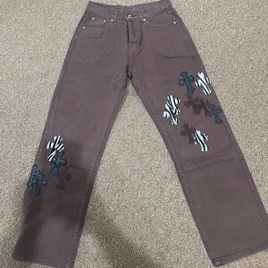 Brown denim jeans with cross patches